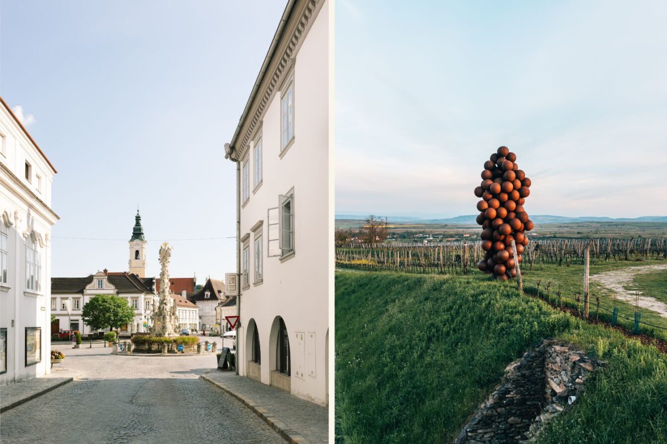 Die Ortschaft Langenlois und eine übergroße Weintrauben-Skulptur