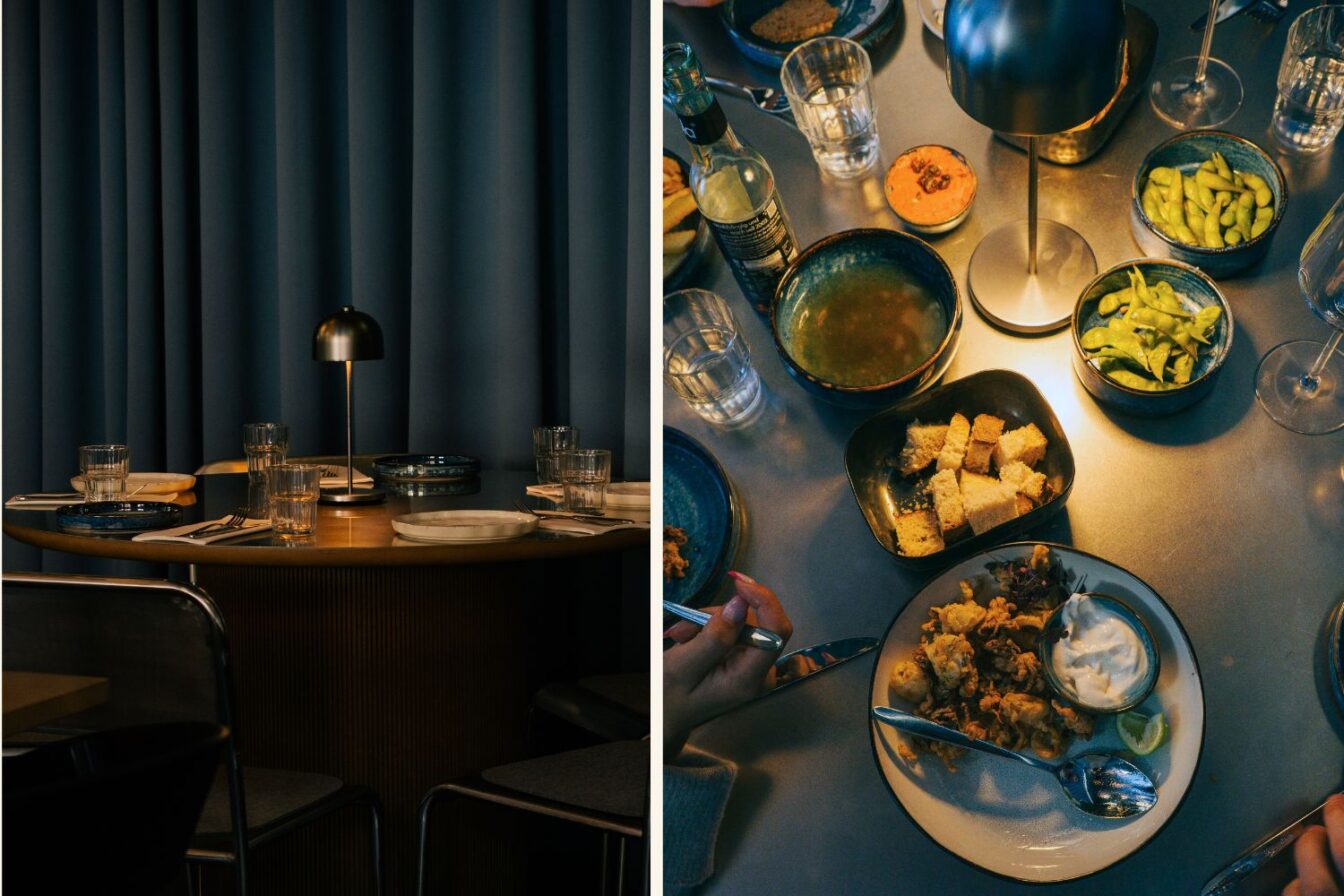 Ein gedeckter Tisch bei schummrigen Licht und viele Fischspeisen im Restaurant