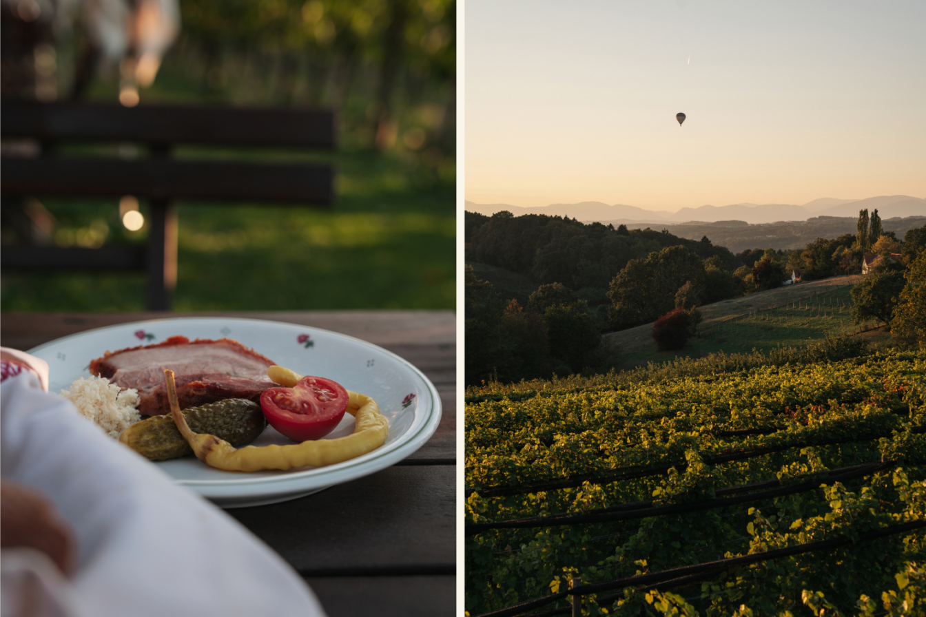 Teller mit traditionellem Geselchtem, Kren und Pfefferoni vor dem Panoramablick auf steirische Weinberge und einen Heißluftballon im Abendlicht.